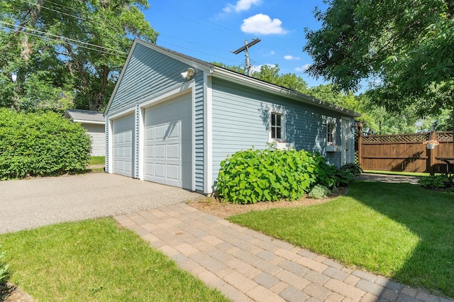 922 Fillmore St, Alexandria, MN 56308 - view of home's exterior featuring a detached garage and an outdoor structure