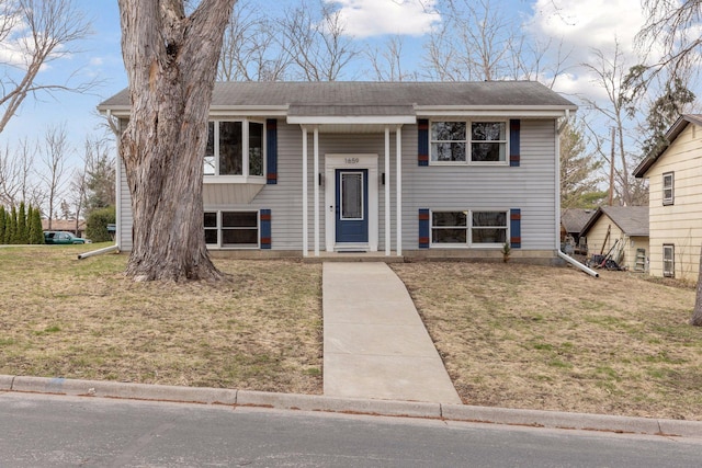 1659 Heron Ln, Mound, MN 55364 - raised ranch featuring a front yard and roof with shingles