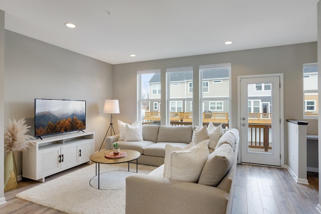 645 Satori Way, Chaska, MN 55318 - living area featuring light wood-style flooring, recessed lighting, and baseboards