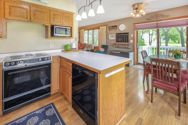 4195 25th St NE, Sauk Rapids, MN 56379 - kitchen with electric range, stainless steel microwave, light countertops, beverage cooler, and light wood-style floors
