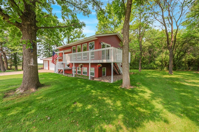 4195 25th St NE, Sauk Rapids, MN 56379 - view of front facade featuring stairway, a deck, a front yard, and an outdoor structure
