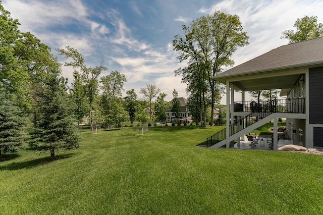 3039 Lady Slipper Ln SW, Rochester, MN 55902 - view of green lawn featuring stairs and a patio area