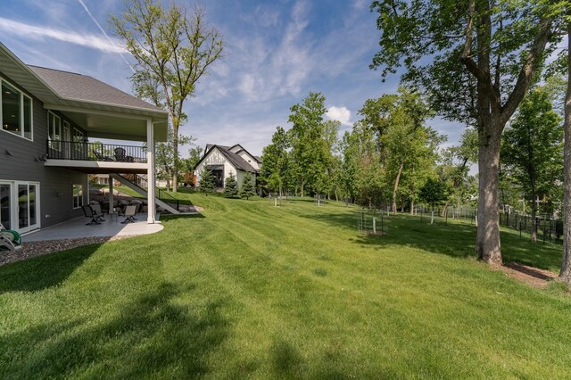 3039 Lady Slipper Ln SW, Rochester, MN 55902 - view of green lawn featuring a patio area, stairs, and a deck