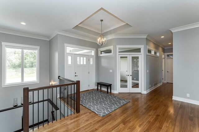 3039 Lady Slipper Ln SW, Rochester, MN 55902 - entrance foyer featuring crown molding, a chandelier, wood finished floors, french doors, and recessed lighting