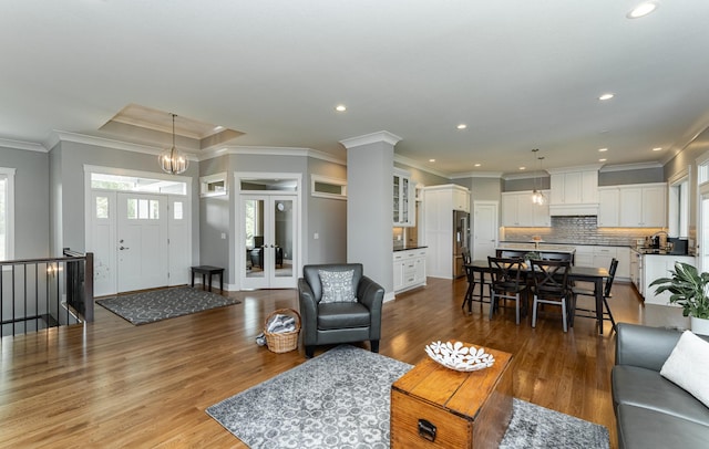 3039 Lady Slipper Ln SW, Rochester, MN 55902 - living area featuring dark wood-type flooring, recessed lighting, and ornamental molding