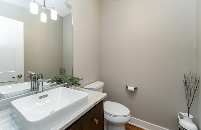 3039 Lady Slipper Ln SW, Rochester, MN 55902 - bathroom with vanity and wood finished floors