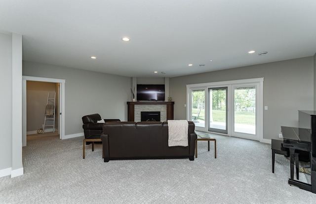 3039 Lady Slipper Ln SW, Rochester, MN 55902 - living area featuring a fireplace, light carpet, and recessed lighting