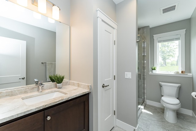 3039 Lady Slipper Ln SW, Rochester, MN 55902 - bathroom with vanity, a shower stall, and marble look tiles