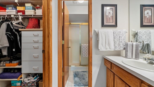 2606 Lake Court Dr, Mounds View, MN 55112 - full bath with a stall shower, vanity, and tile patterned flooring