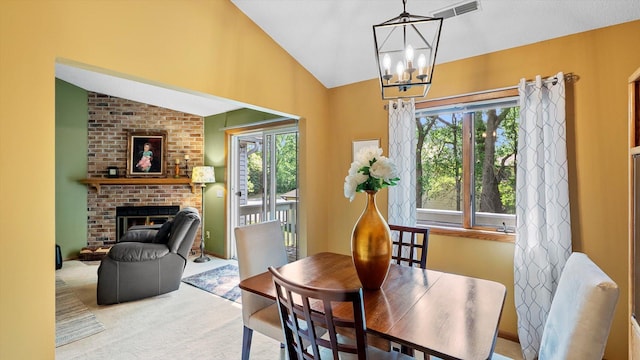 2606 Lake Court Dr, Mounds View, MN 55112 - carpeted dining area featuring lofted ceiling, healthy amount of natural light, a fireplace, and a chandelier