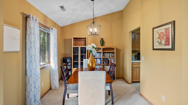 2606 Lake Court Dr, Mounds View, MN 55112 - dining area with a chandelier, lofted ceiling, light carpet, and baseboards