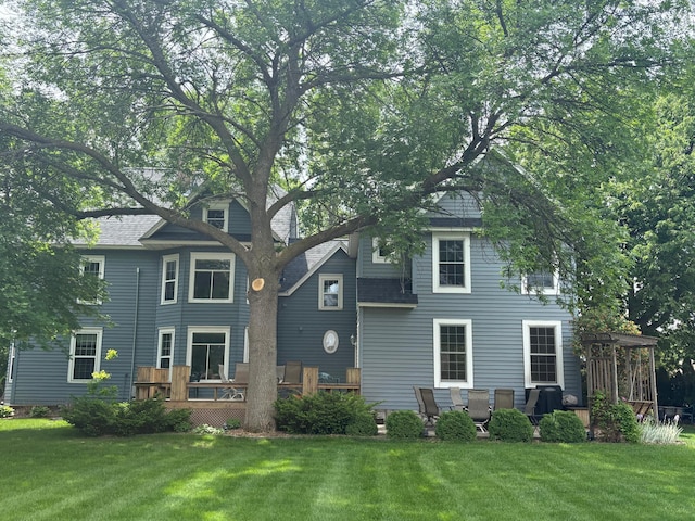 1710 Maple Ave, Benson, MN 56215 - view of front facade featuring a wooden deck, a front yard, a pergola, and roof with shingles
