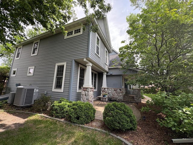 1710 Maple Ave, Benson, MN 56215 - rear view of property with central AC unit and stone siding