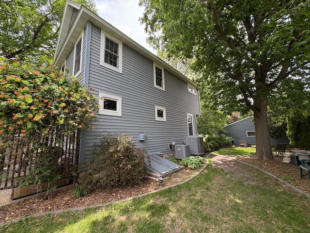 1710 Maple Ave, Benson, MN 56215 - view of property exterior featuring cooling unit and a lawn