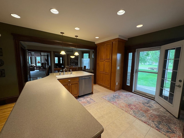 1710 Maple Ave, Benson, MN 56215 - kitchen featuring dishwasher, a sink, brown cabinetry, decorative light fixtures, and recessed lighting