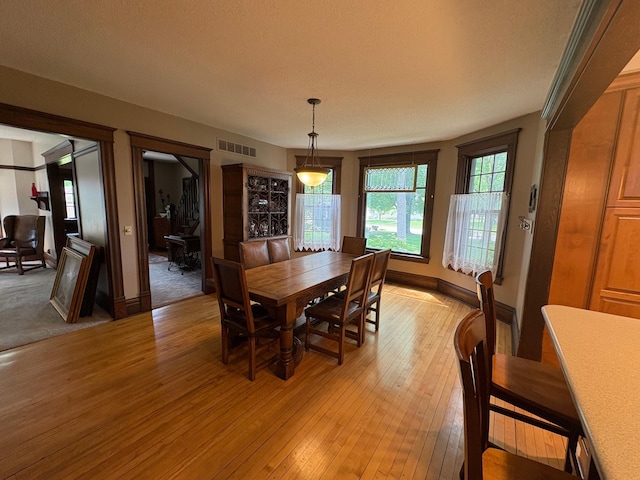 1710 Maple Ave, Benson, MN 56215 - dining room featuring light wood-style flooring and baseboards