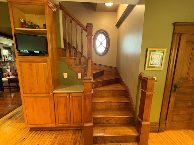 1710 Maple Ave, Benson, MN 56215 - stairs with hardwood / wood-style flooring and baseboards