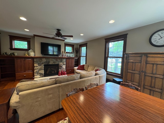 1710 Maple Ave, Benson, MN 56215 - living room featuring recessed lighting, wood finished floors, a fireplace, and ceiling fan