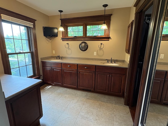1710 Maple Ave, Benson, MN 56215 - bathroom featuring plenty of natural light and double vanity