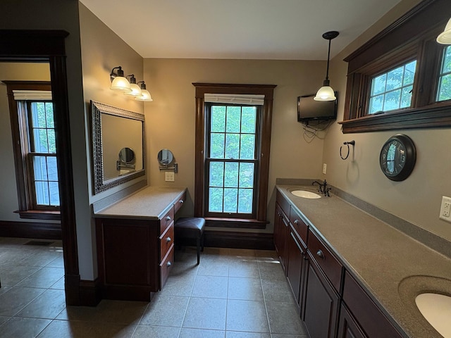 1710 Maple Ave, Benson, MN 56215 - full bath featuring plenty of natural light, double vanity, tile patterned floors, and baseboards