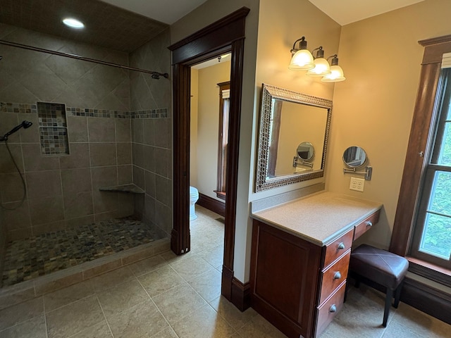 1710 Maple Ave, Benson, MN 56215 - full bath with toilet, tiled shower, vanity, and baseboards