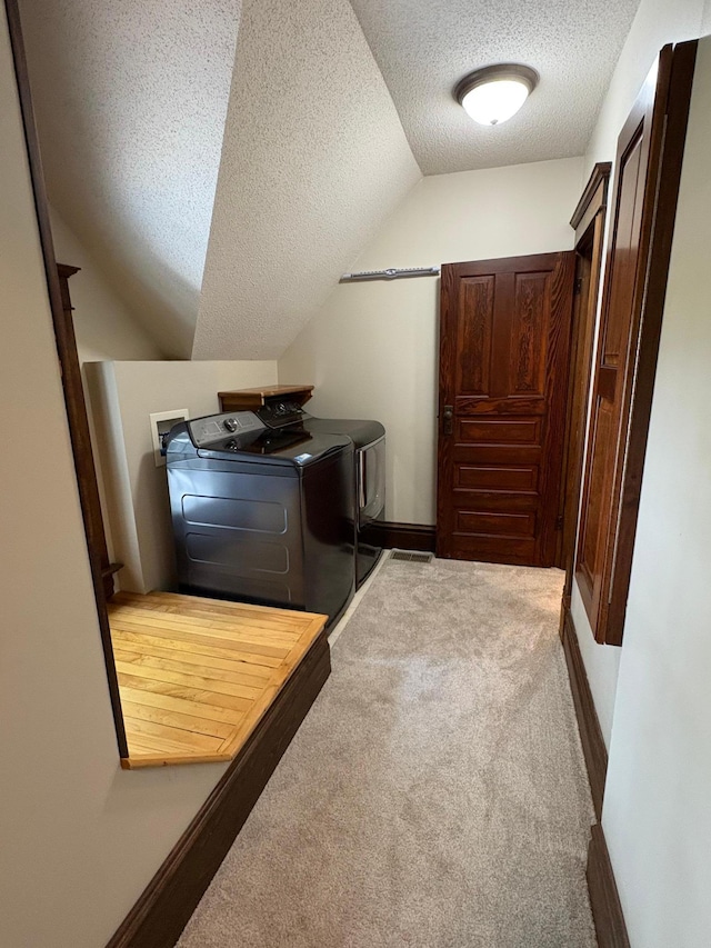 1710 Maple Ave, Benson, MN 56215 - washroom featuring a textured ceiling, independent washer and dryer, carpet, and baseboards