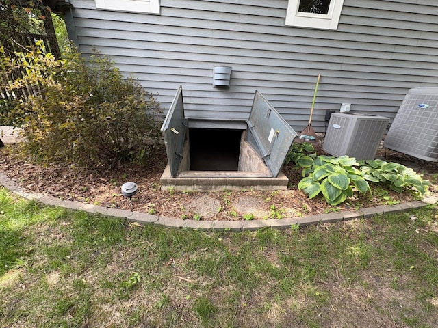 1710 Maple Ave, Benson, MN 56215 - exterior view of central AC and a bulkhead entry
