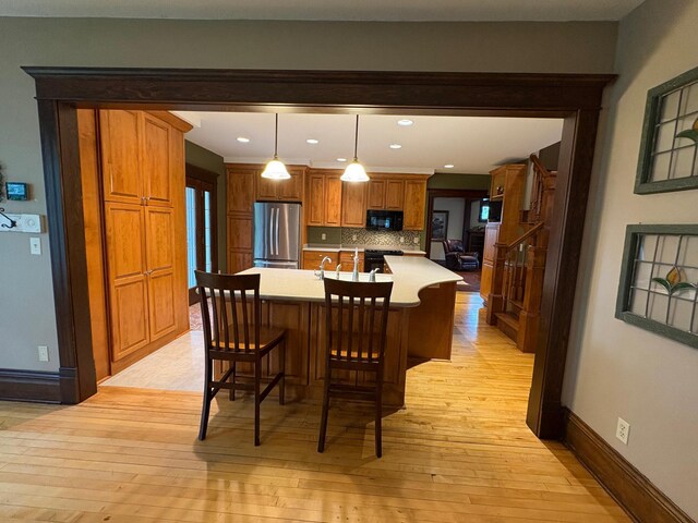 1710 Maple Ave, Benson, MN 56215 - dining room with light wood finished floors, recessed lighting, and baseboards