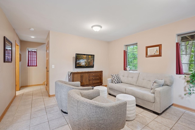 501 Lakeshore Blvd W, Onamia, MN 56359 - living room with light tile patterned flooring, baseboards, and healthy amount of natural light