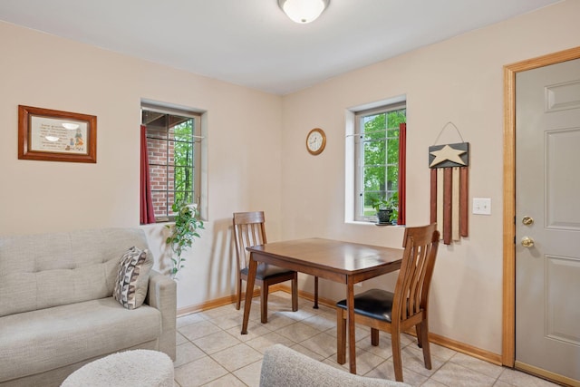 501 Lakeshore Blvd W, Onamia, MN 56359 - dining area featuring plenty of natural light, baseboards, and light tile patterned floors