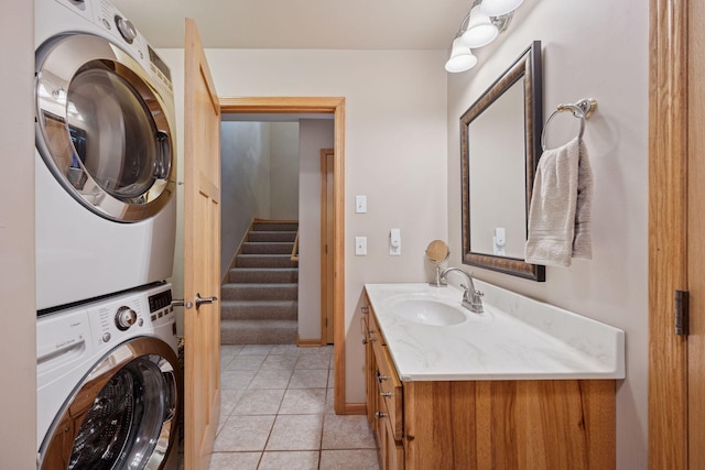 501 Lakeshore Blvd W, Onamia, MN 56359 - bathroom featuring stacked washer / drying machine, vanity, tile patterned flooring, and baseboards