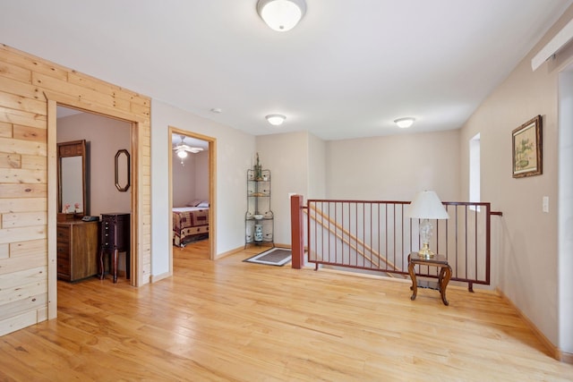 501 Lakeshore Blvd W, Onamia, MN 56359 - sitting room featuring an upstairs landing, light wood-style flooring, and baseboards