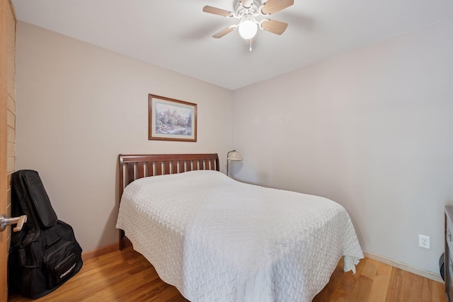 501 Lakeshore Blvd W, Onamia, MN 56359 - bedroom featuring wood finished floors, baseboards, and ceiling fan