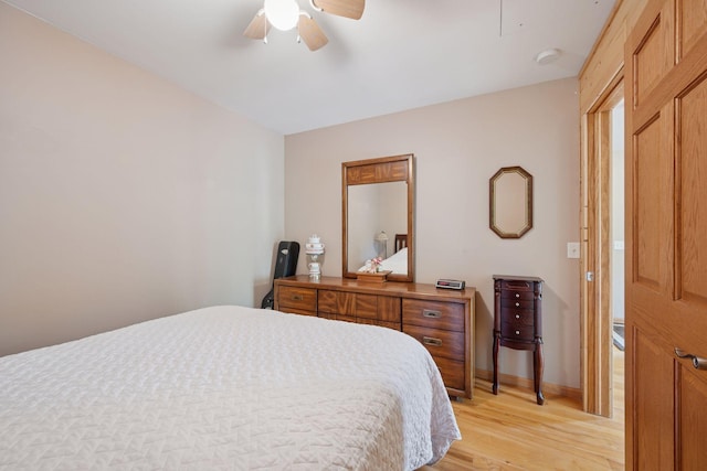 501 Lakeshore Blvd W, Onamia, MN 56359 - bedroom with light wood-style floors, baseboards, ceiling fan, and attic access