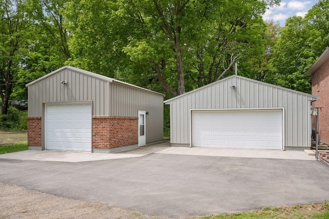 501 Lakeshore Blvd W, Onamia, MN 56359 - detached garage with view of scattered trees