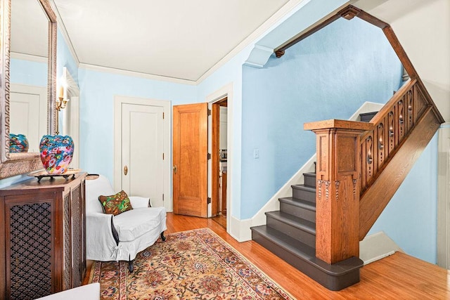2401 5th St, Duluth, MN 55812 - entryway with light wood-style flooring, stairs, and crown molding