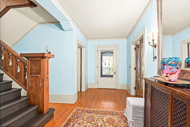 2401 5th St, Duluth, MN 55812 - entryway with wood finished floors, baseboards, stairs, and crown molding