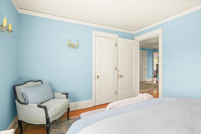2401 5th St, Duluth, MN 55812 - bedroom with ornamental molding, baseboards, and wood finished floors