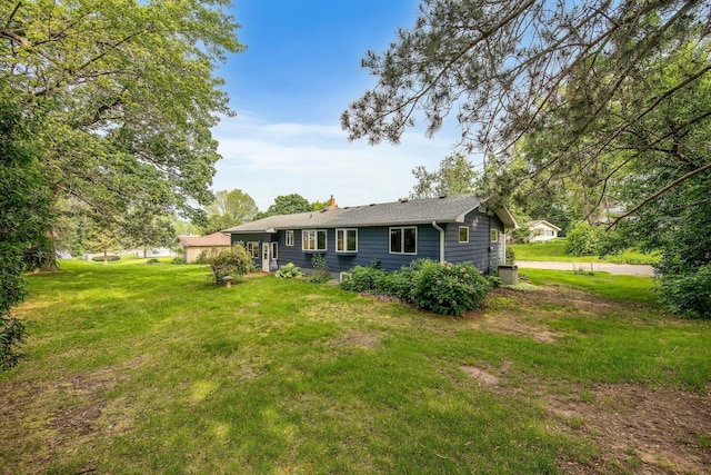 1121 Ramsey St W, Stillwater, MN 55082 - back of house with a yard and a chimney