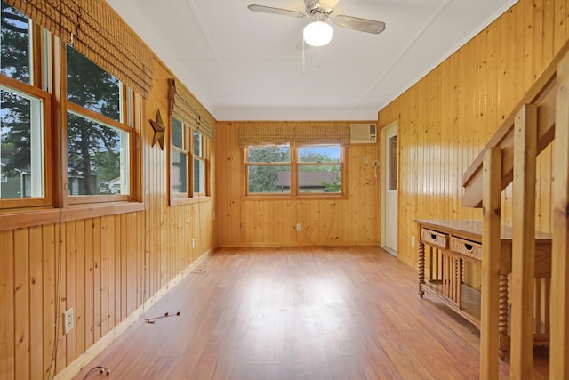 1121 Ramsey St W, Stillwater, MN 55082 - empty room with wood finished floors, a wall mounted air conditioner, ceiling fan, and wooden walls