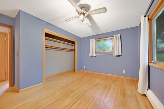 1121 Ramsey St W, Stillwater, MN 55082 - unfurnished bedroom with wood finished floors, a closet, and a ceiling fan