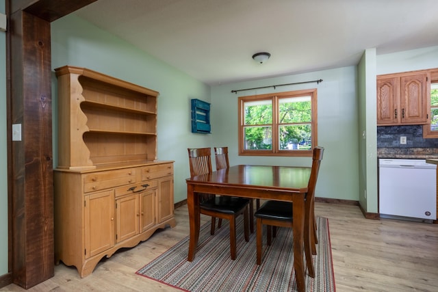 615 Eisenhower Dr, Saint Croix Falls, WI 54024 - dining area with light wood-style floors, healthy amount of natural light, and baseboards