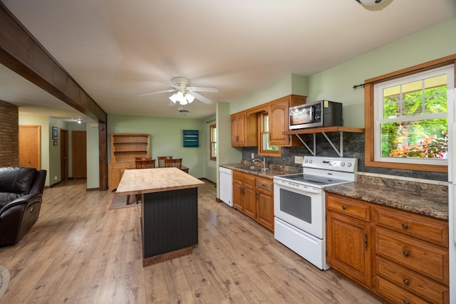 615 Eisenhower Dr, Saint Croix Falls, WI 54024 - kitchen featuring white appliances, a sink, ceiling fan, and light wood-style floors