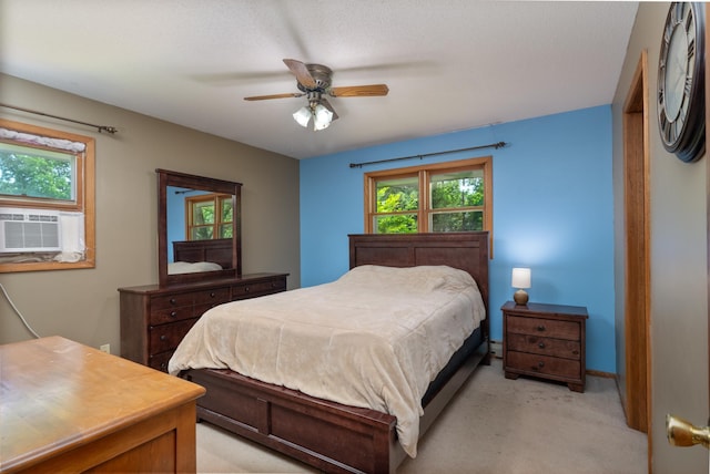 615 Eisenhower Dr, Saint Croix Falls, WI 54024 - bedroom with light carpet, a ceiling fan, cooling unit, and baseboards