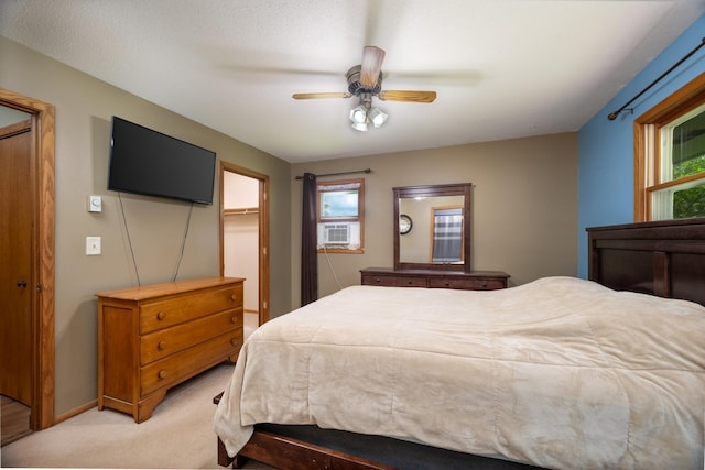 615 Eisenhower Dr, Saint Croix Falls, WI 54024 - bedroom with light carpet, cooling unit, a ceiling fan, a closet, and a spacious closet