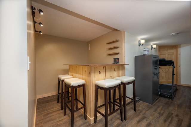 615 Eisenhower Dr, Saint Croix Falls, WI 54024 - indoor dry bar with wood finished floors, baseboards, and freestanding refrigerator