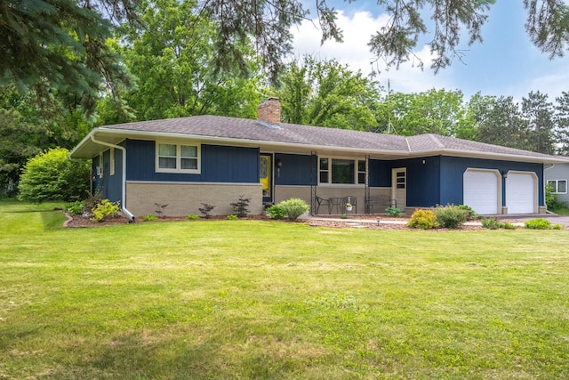 615 Eisenhower Dr, Saint Croix Falls, WI 54024 - single story home with an attached garage, a chimney, a front yard, and brick siding