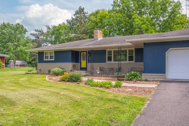 615 Eisenhower Dr, Saint Croix Falls, WI 54024 - ranch-style home featuring a chimney, a front lawn, an attached garage, and a shingled roof