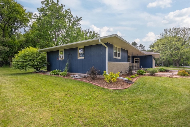 615 Eisenhower Dr, Saint Croix Falls, WI 54024 - view of property exterior featuring a yard and brick siding