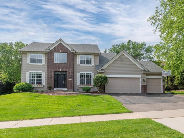 15000 Bridgewater Dr, Savage, MN 55378 - colonial-style house with asphalt driveway, an attached garage, a front lawn, and brick siding